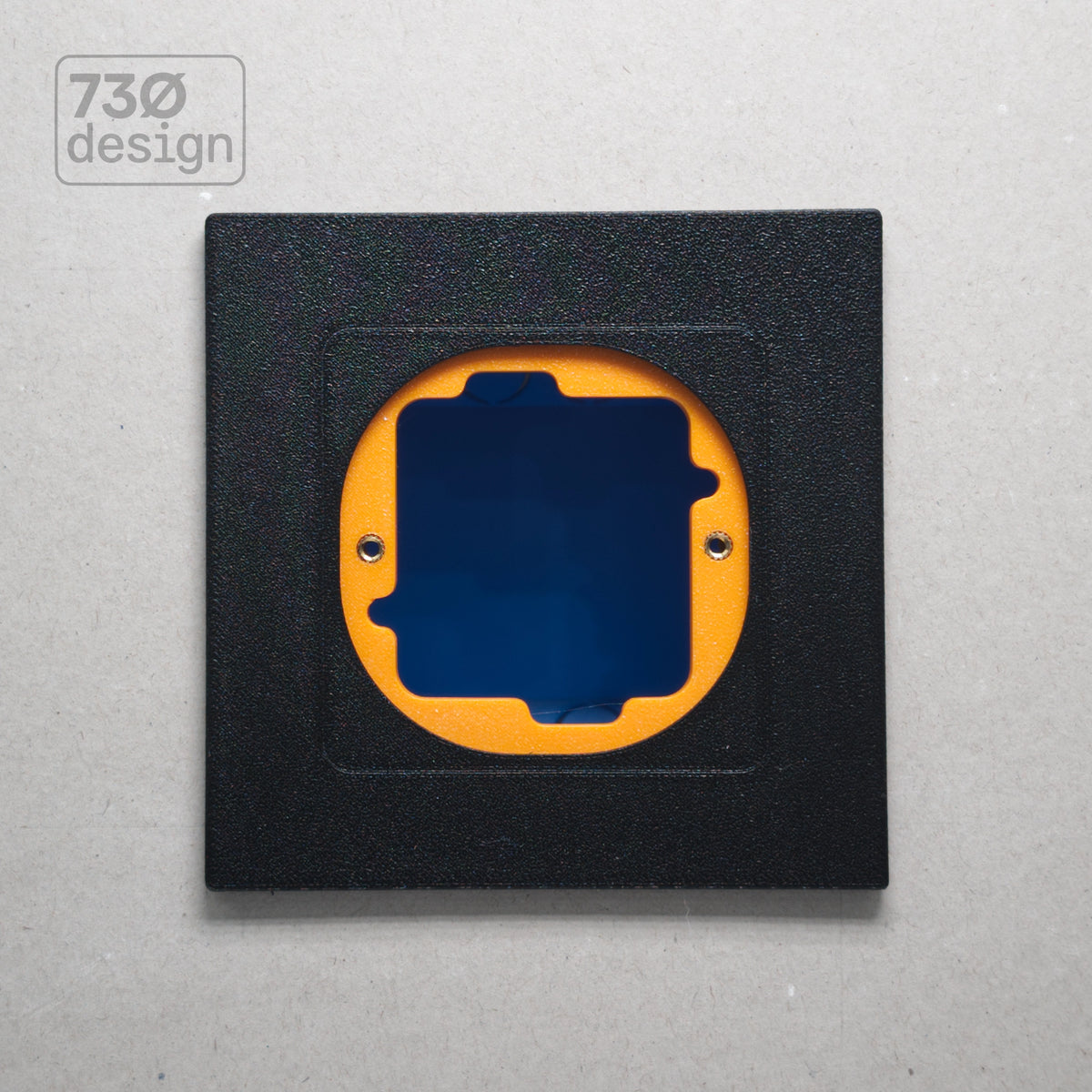 ControlFix NA 2-Gang adapter plate in Obsidian Black - front view before panel installation, showing orange mounting plate through cutout. Compatible with Dynalite Revolution Display (PDRDE), Revolution Button EU (PDRxE), and Dynalite Antumbra EU panels