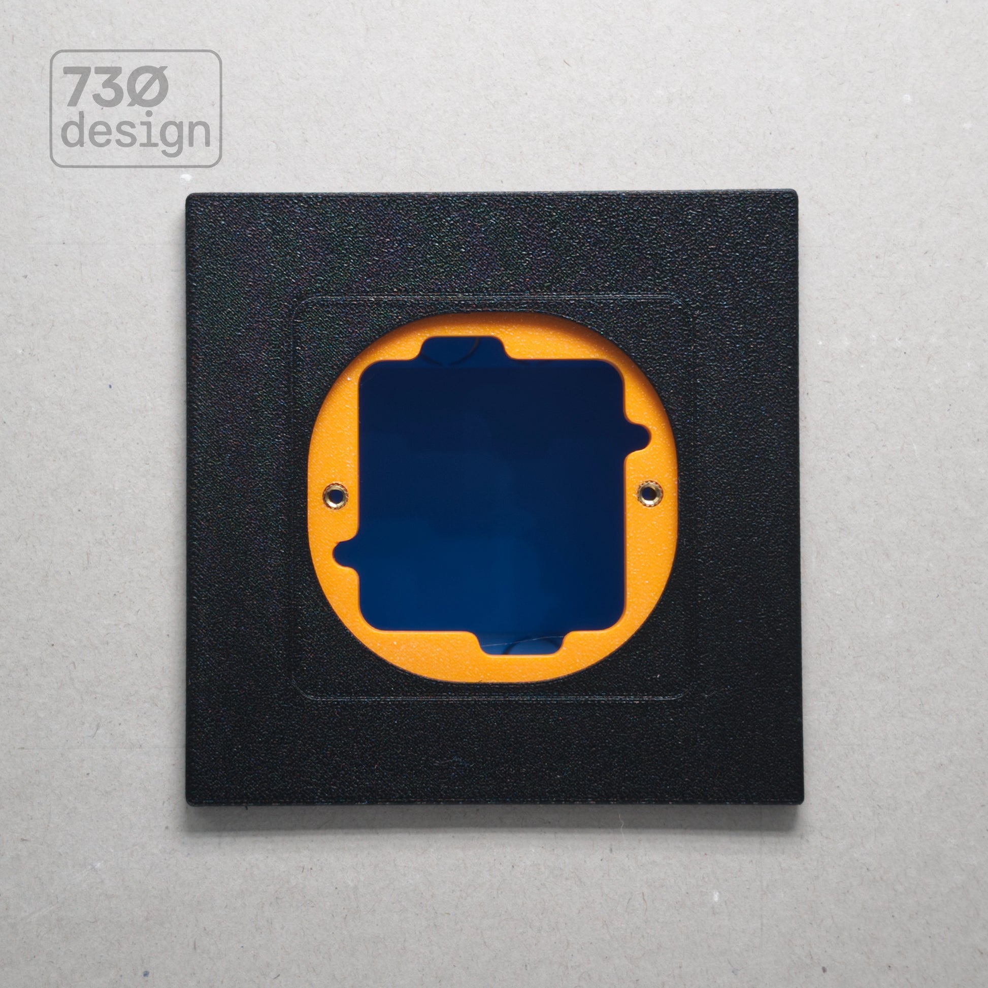 ControlFix NA 2-Gang adapter plate in Obsidian Black - front view before panel installation, showing orange mounting plate through cutout. Compatible with Dynalite Revolution Display (PDRDE), Revolution Button EU (PDRxE), and Dynalite Antumbra EU panels
