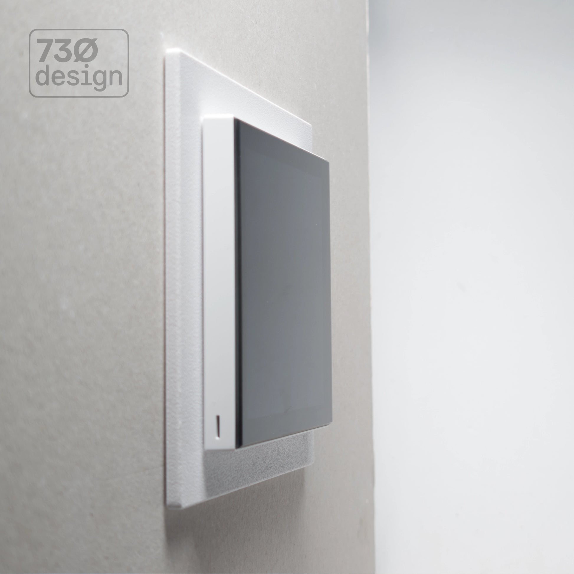 ControlFix NA 2-Gang Type 86 adapter plate in white - angled view showing Dynalite Revolution EU panel installed on a wall, 60.3mm (60mm) fixing centres. Compatible with Revolution Display (PDRDE), Revolution Button EU (PDRxE), and Dynalite Antumbra EU panels