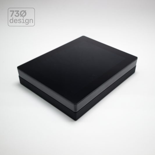 ControlSurface Fit surface-mount bracket in Obsidian Black with Pharos TPS8 touchscreen installed - front angled view. Verified compatible with Pharos XPT8 Express Touch and ETC Mosaic M-TS8, PoE and PoE+ compatible